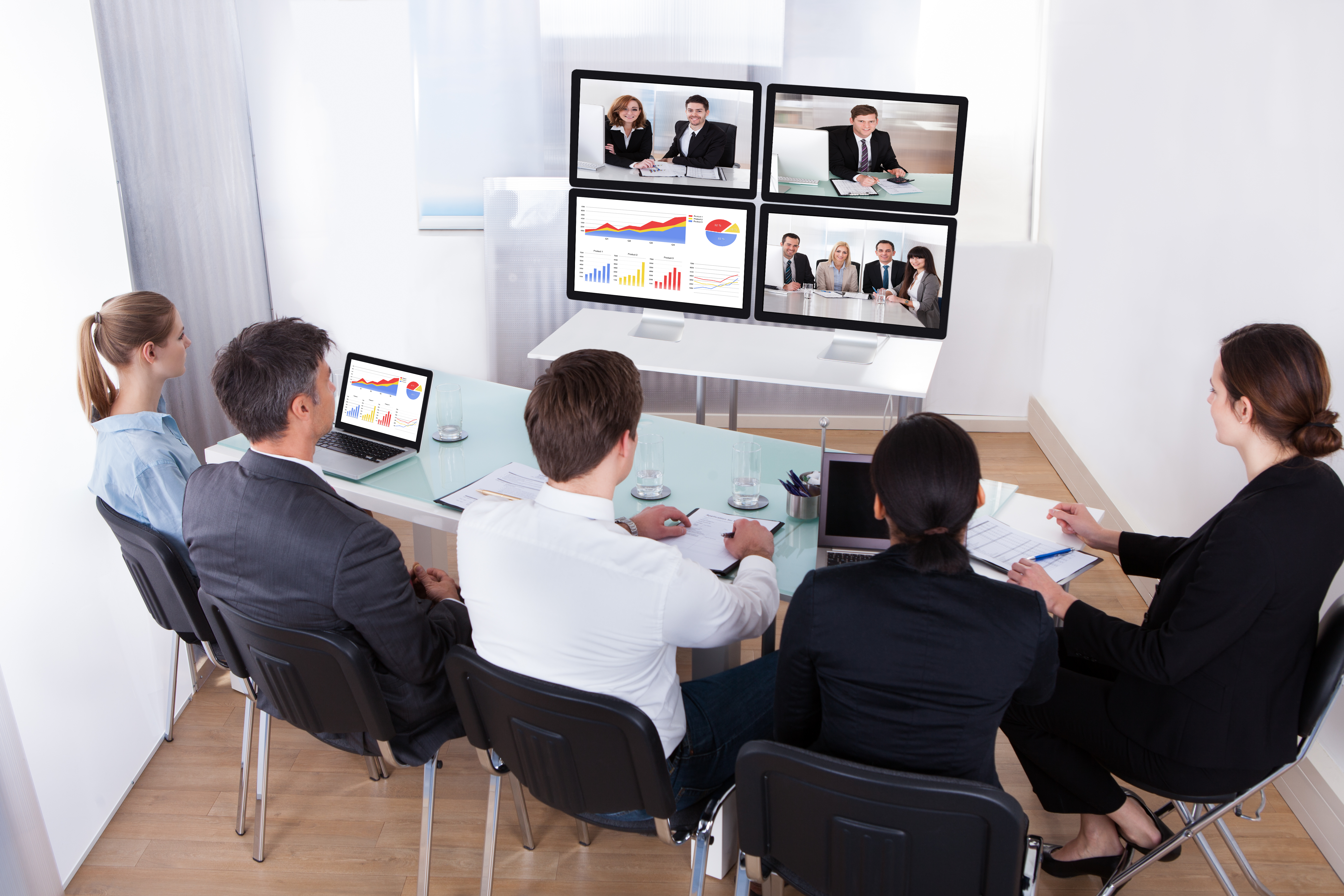 High Angle View Of Businesspeople In Video Conference At Business Meeting